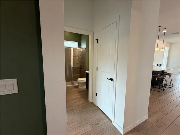 a view of a bathroom from the hallway