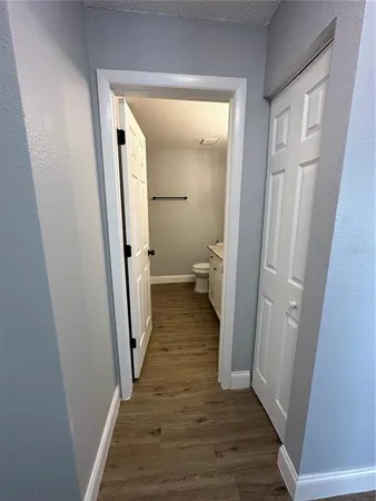 a view of a bathroom from a hallway