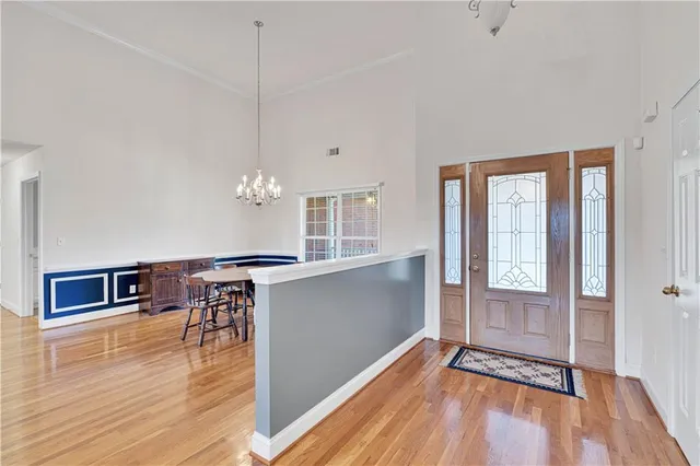 a view of a room with wooden floor and staircase