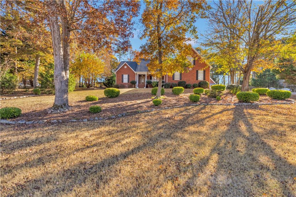 523 Barhams Ridge Drive McDonough, GA 30252 - Photo 2 of 43 a view of a yard with a tree