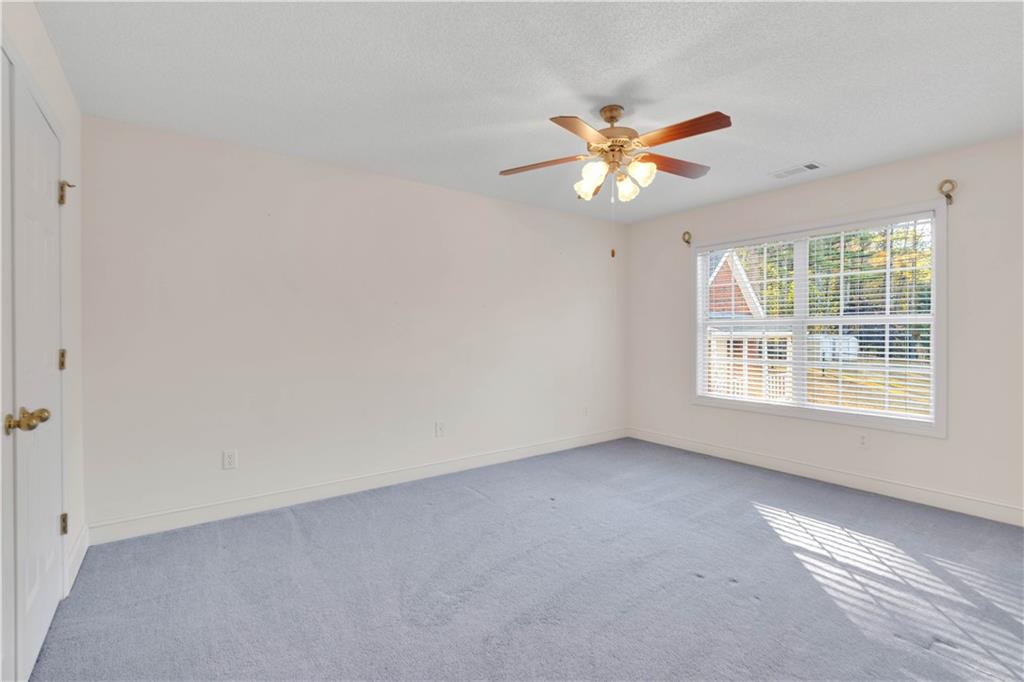 523 Barhams Ridge Drive McDonough, GA 30252 - Photo 25 of 43 a view of an empty room with a window