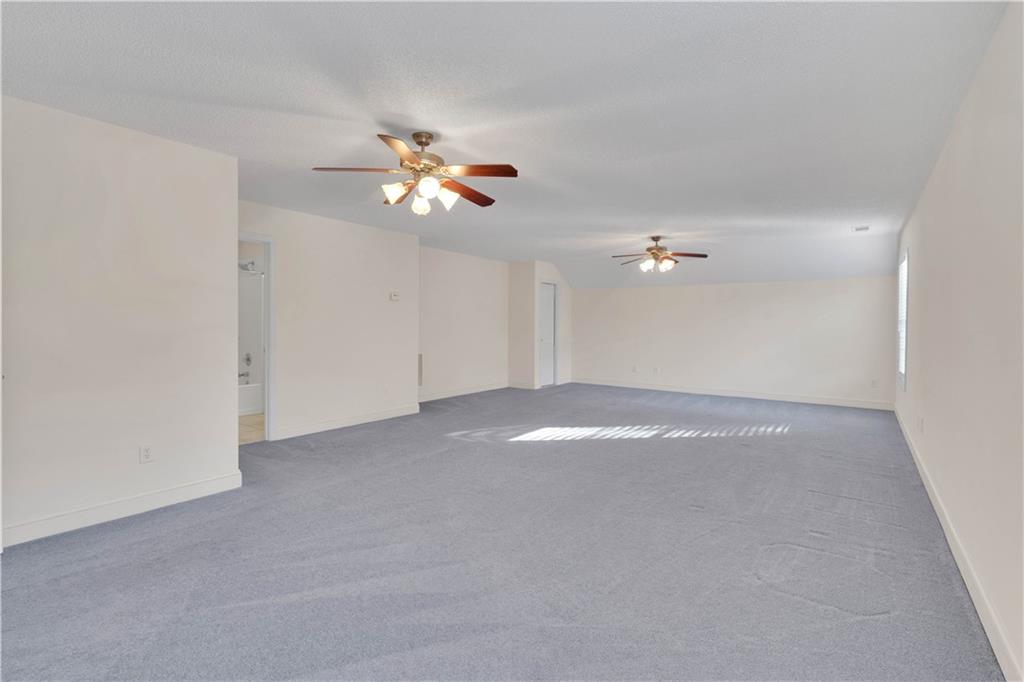 523 Barhams Ridge Drive McDonough, GA 30252 - Photo 26 of 43 wooden floor in an empty room with a window
