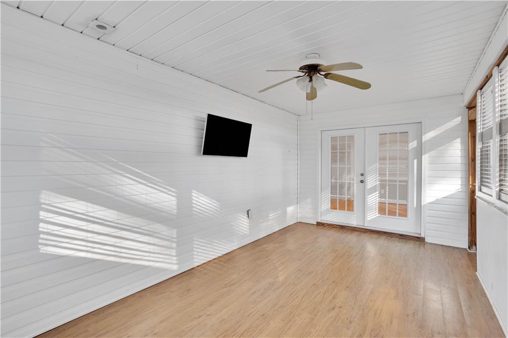 523 Barhams Ridge Drive McDonough, GA 30252 - Photo 29 of 43 a view of an empty room with a window and wooden floor