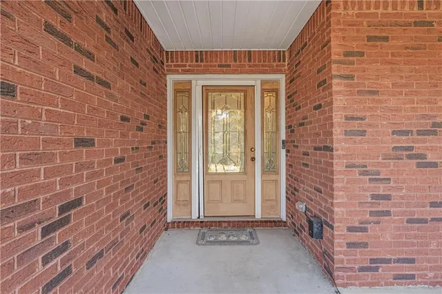 a view of a brick house with windows