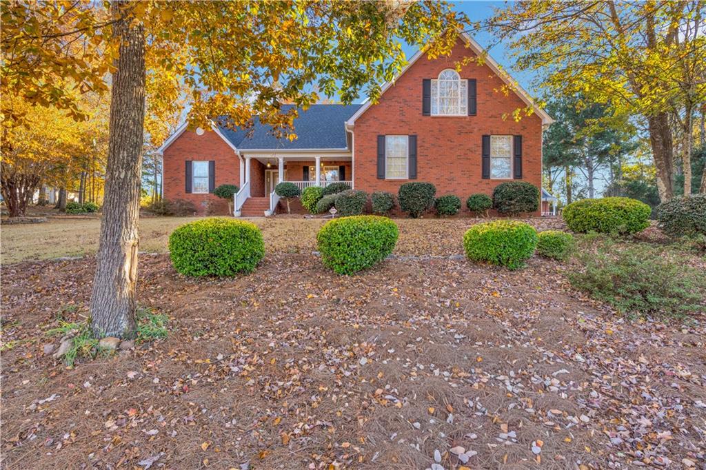 523 Barhams Ridge Drive McDonough, GA 30252 - Photo 5 of 43 a front view of a house with garden