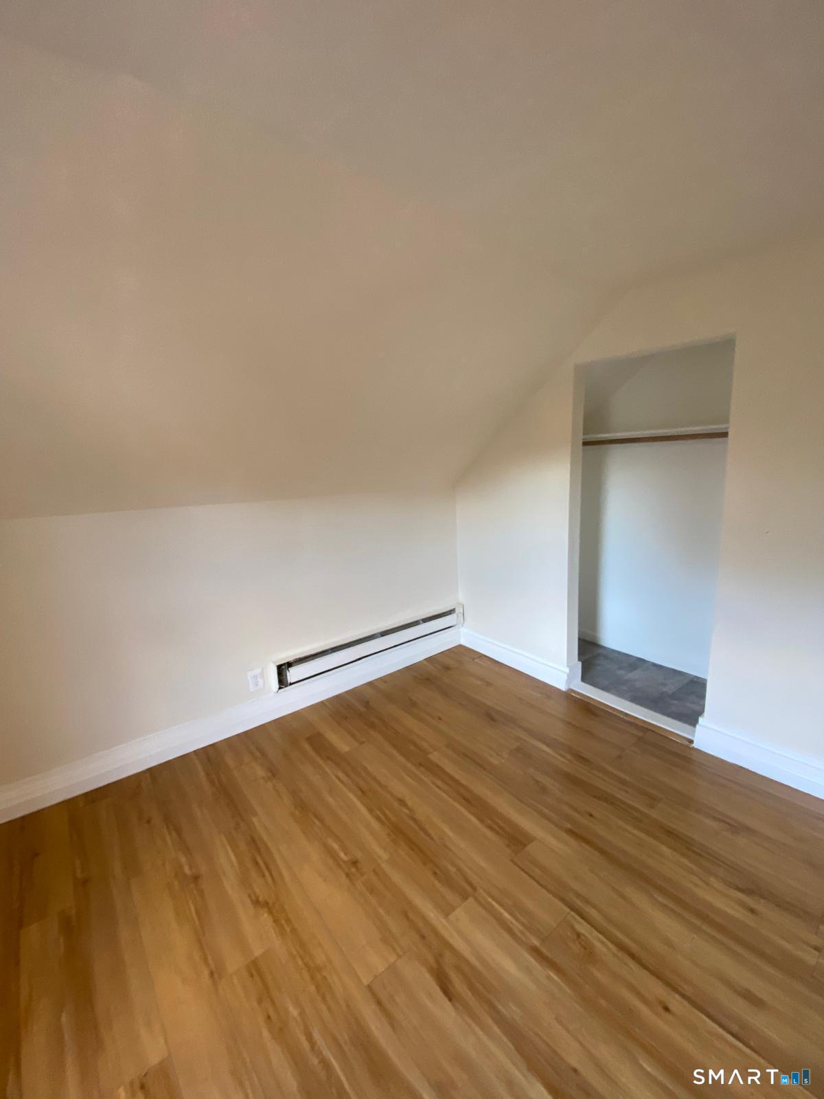 54 North Avenue Meriden, CT 06451 - Photo 11 of 18 a view of empty room with wooden floor