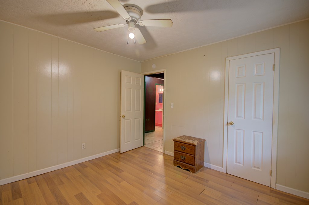 92 No-Where Road Blairsville, GA 30512 - Photo 15 of 36 an empty room with wooden floor and windows