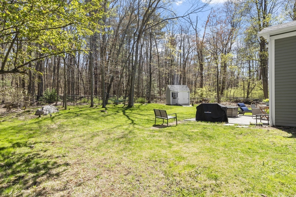 203 Main Street Acton, MA 01720 - Photo 11 of 42 a swimming pool with chairs and bench