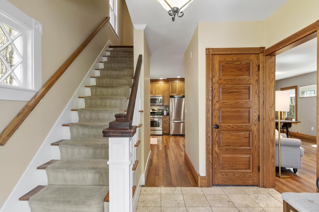 203 Main Street Acton, MA 01720 - Photo 14 of 42 a view of entryway and hall with wooden floor