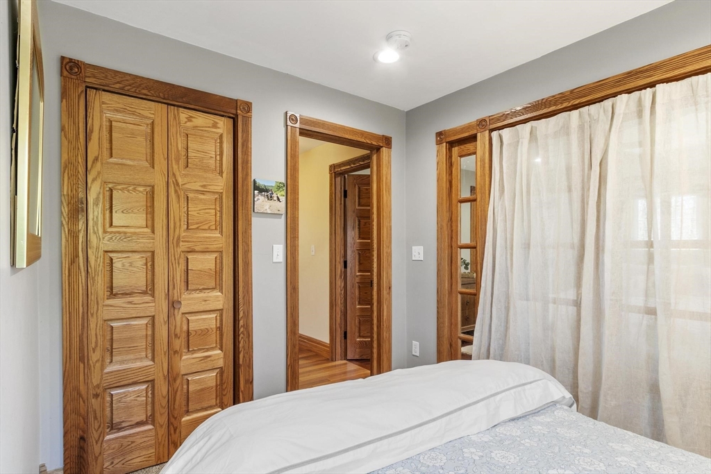 203 Main Street Acton, MA 01720 - Photo 35 of 42 a bedroom with a bed and a window