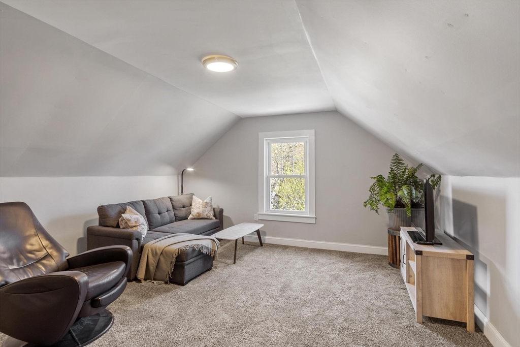203 Main Street Acton, MA 01720 - Photo 41 of 42 a living room with furniture and a window