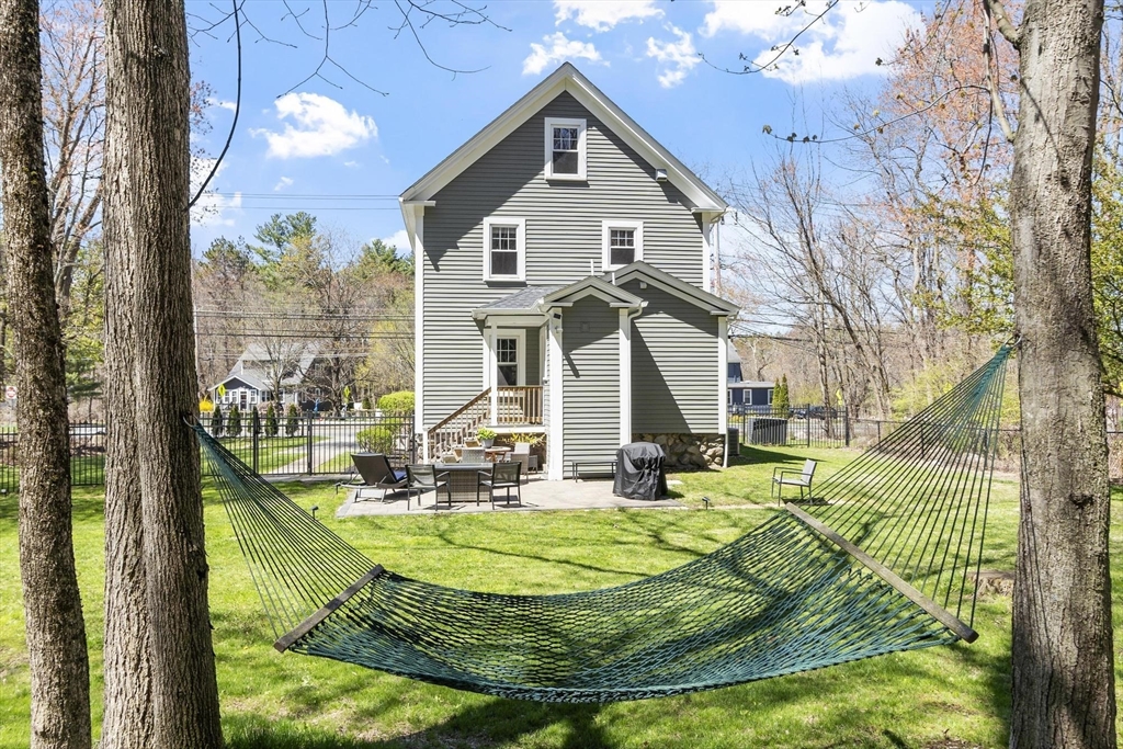 203 Main Street Acton, MA 01720 - Photo 7 of 42 a view of a house with yard and sitting area
