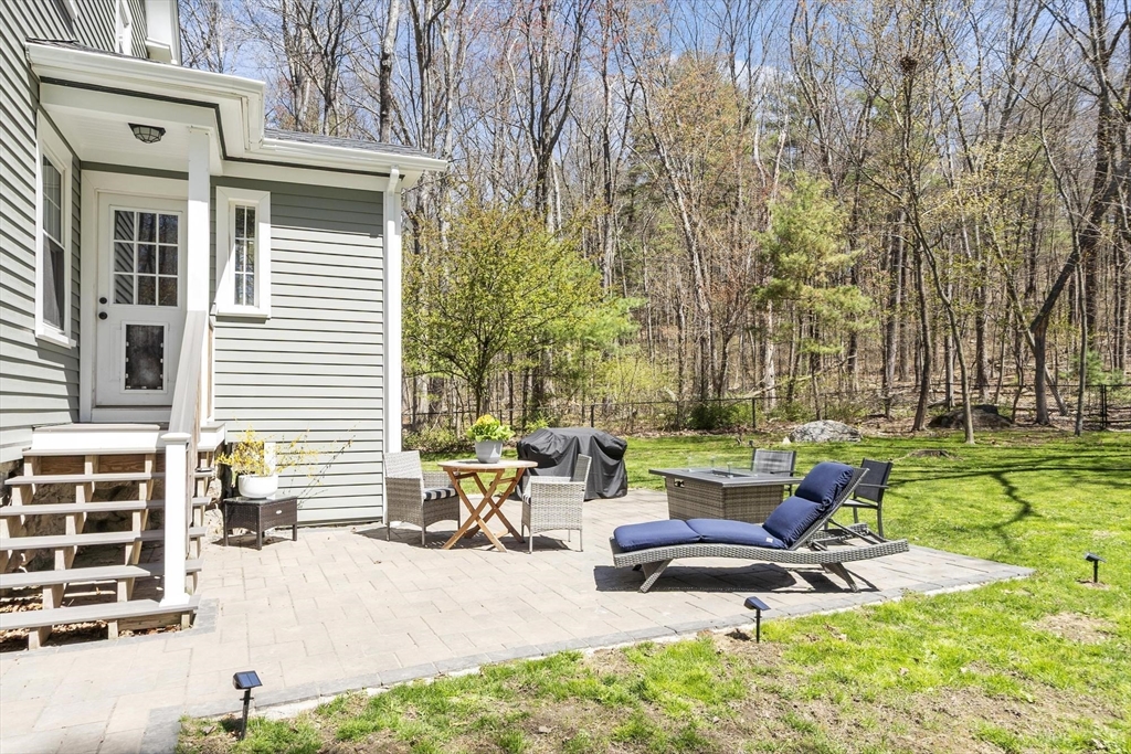 203 Main Street Acton, MA 01720 - Photo 9 of 42 a building outdoor space with patio furniture