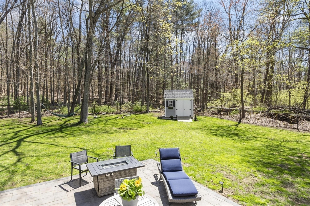 203 Main Street Acton, MA 01720 - Photo 10 of 42 a view of backyard with swimming pool