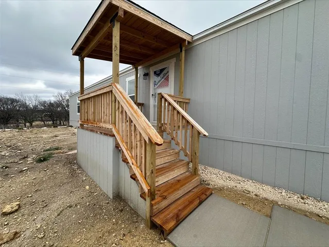 a view of a refrigerator in kitchen and wooden floor