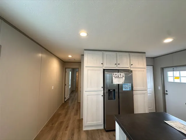 a view of a livingroom with a kitchen
