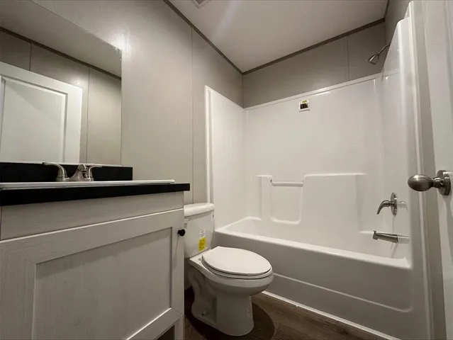 a bathroom with a tub and a shower