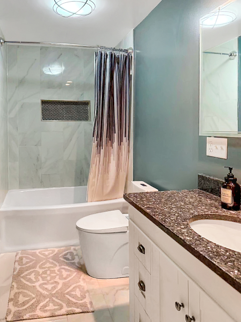 1008 Ascot Drive Rantoul, IL 61866 - Photo 16 of 24 a bathroom with a granite countertop sink toilet and shower