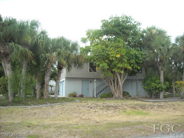 491 Rabbit Road Sanibel, FL 33957 - Photo 1 of 9 a view of a house with a yard