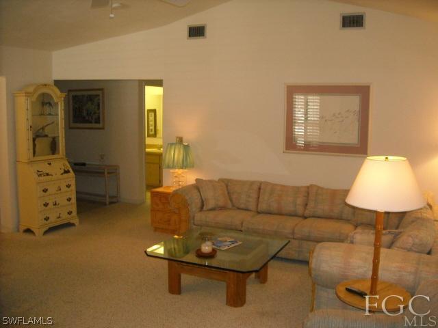 491 Rabbit Road Sanibel, FL 33957 - Photo 3 of 9 a living room with furniture and a lamp