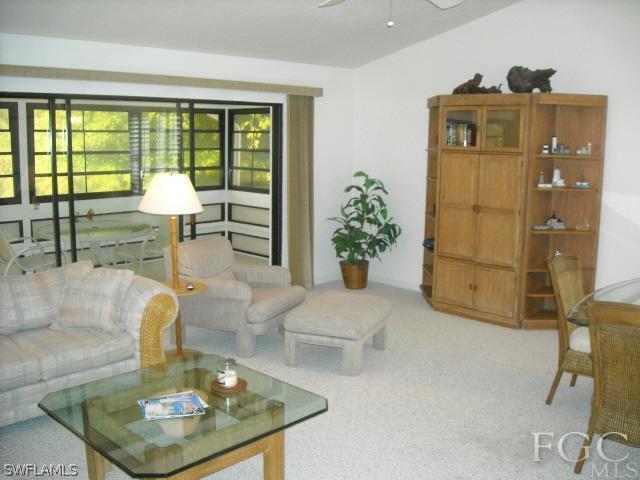 491 Rabbit Road Sanibel, FL 33957 - Photo 5 of 9 a living room with furniture and a window
