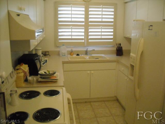 491 Rabbit Road Sanibel, FL 33957 - Photo 6 of 9 a bathroom with a sink and a washing machine
