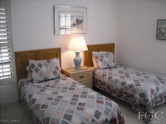 491 Rabbit Road Sanibel, FL 33957 - Photo 9 of 9 a bedroom with a bed and a lamp