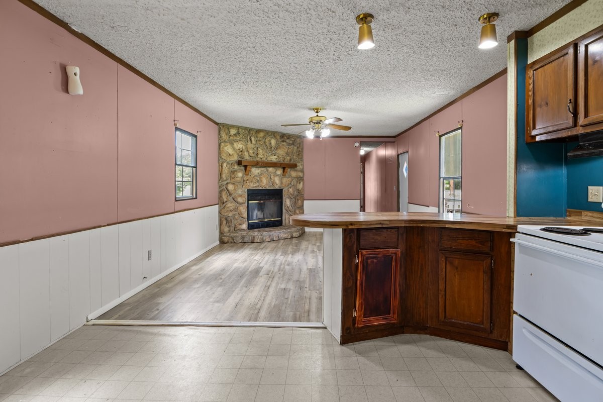 6495 Divider And Natchez Trace Road Camden, TN 38320 - Photo 12 of 31 a view of kitchen with windows and refrigerator