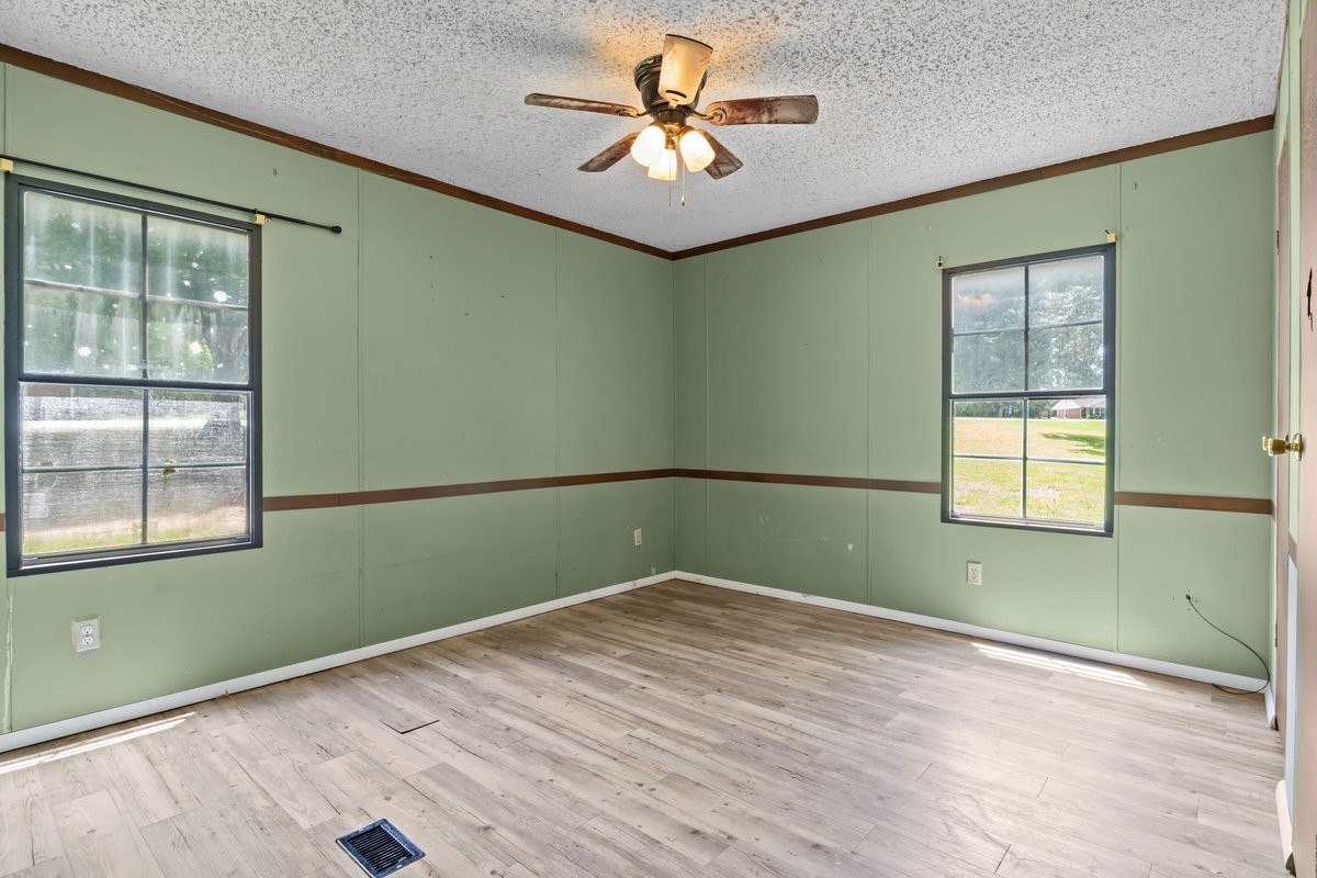 6495 Divider And Natchez Trace Road Camden, TN 38320 - Photo 13 of 31 a view of empty room with window and ceiling fan