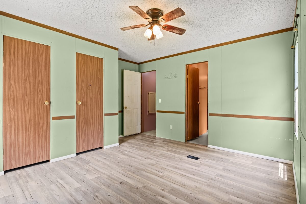 6495 Divider And Natchez Trace Road Camden, TN 38320 - Photo 14 of 31 a view of a livingroom with a chandelier fan