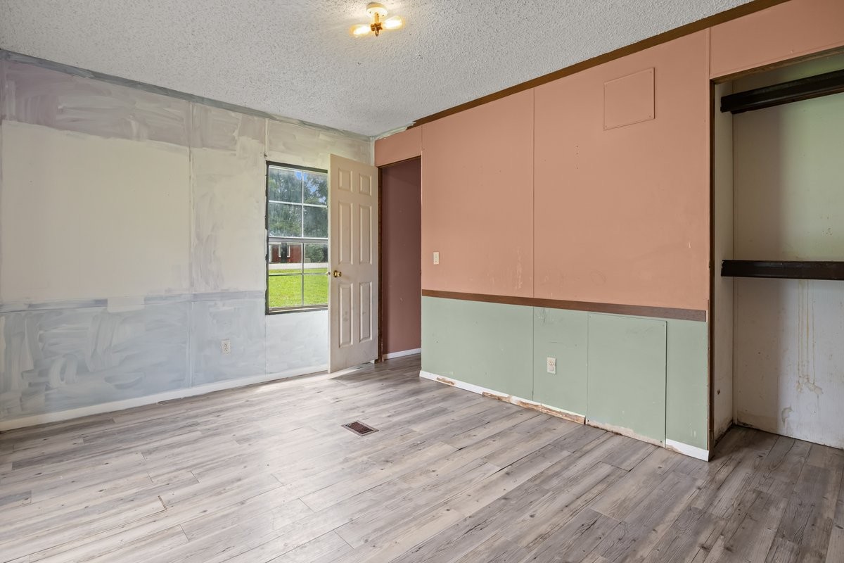 6495 Divider And Natchez Trace Road Camden, TN 38320 - Photo 19 of 31 an empty room with wooden floor and windows