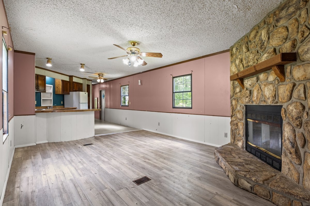 6495 Divider And Natchez Trace Road Camden, TN 38320 - Photo 5 of 31 a view of an empty room with window and wooden floor