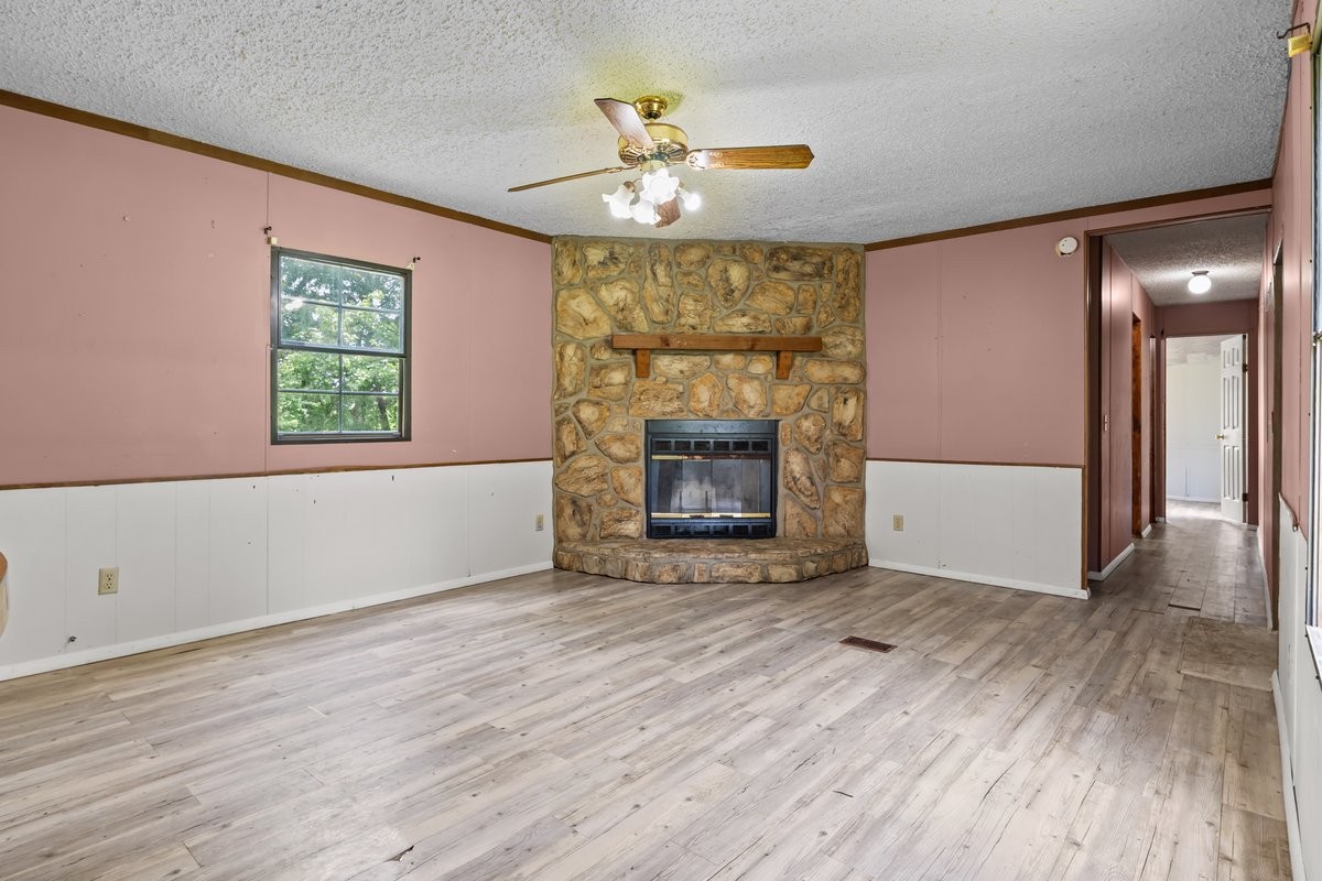 6495 Divider And Natchez Trace Road Camden, TN 38320 - Photo 6 of 31 an empty room with windows and a fireplace