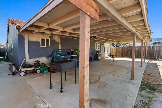 a view of a backyard with hardwood