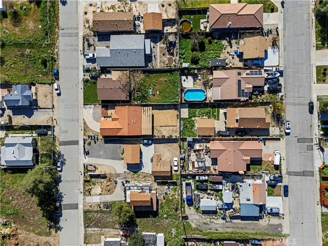 an aerial view of residential house and sandy dunes