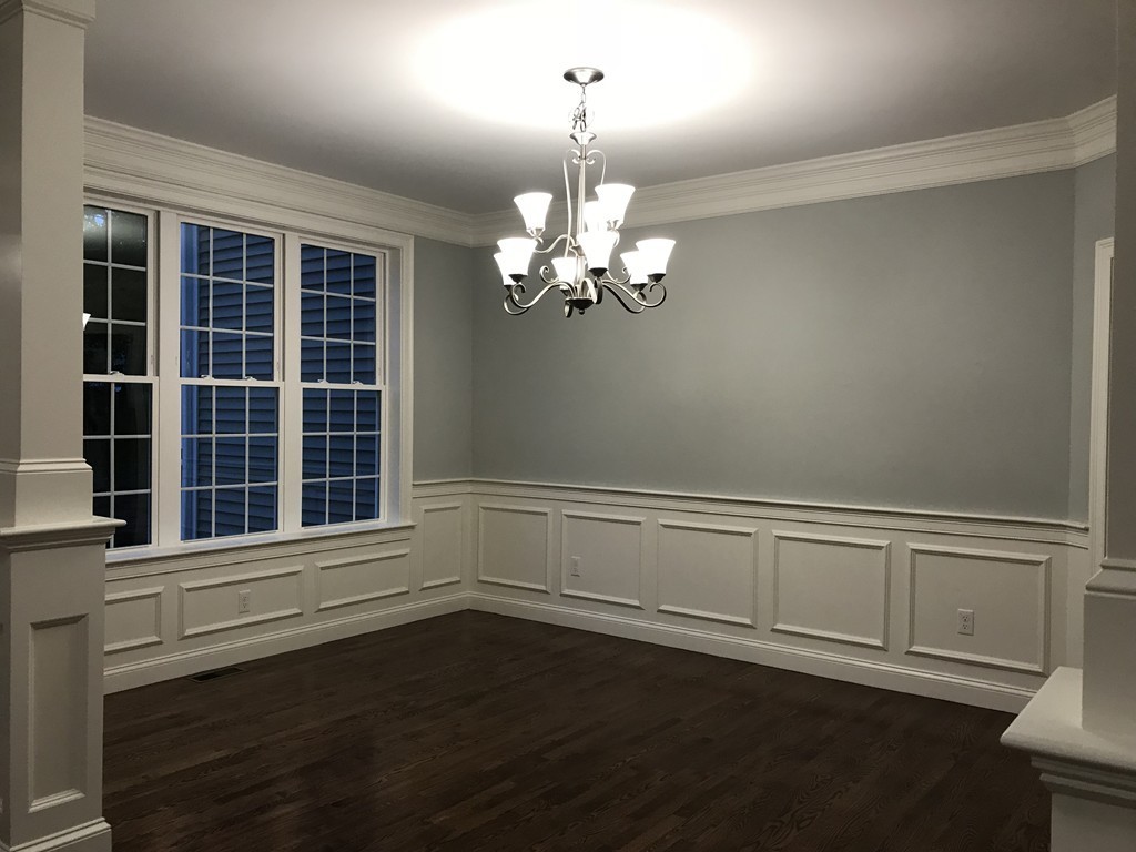 57 Wellesley Rd Extension Natick, MA 01760 - Photo 14 of 26 a view of wooden floor and windows in a room