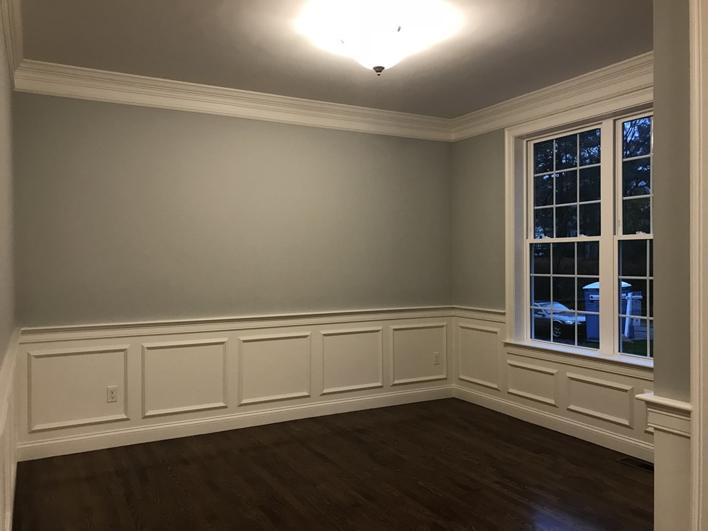 57 Wellesley Rd Extension Natick, MA 01760 - Photo 15 of 26 a view of an empty room with wooden floor and a window