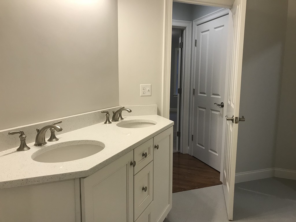 57 Wellesley Rd Extension Natick, MA 01760 - Photo 18 of 26 a bathroom with a sink and a mirror