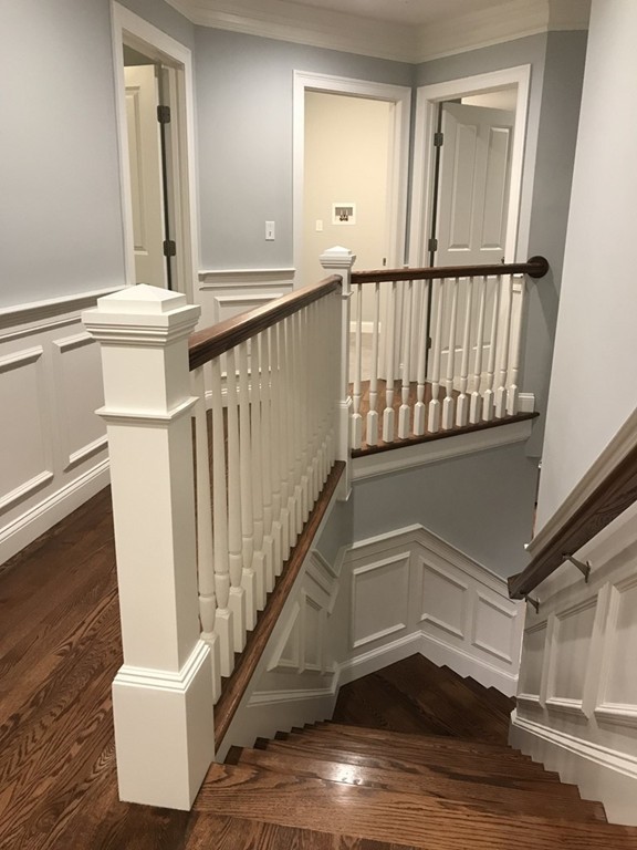 57 Wellesley Rd Extension Natick, MA 01760 - Photo 19 of 26 a view of staircase with white walls and a window