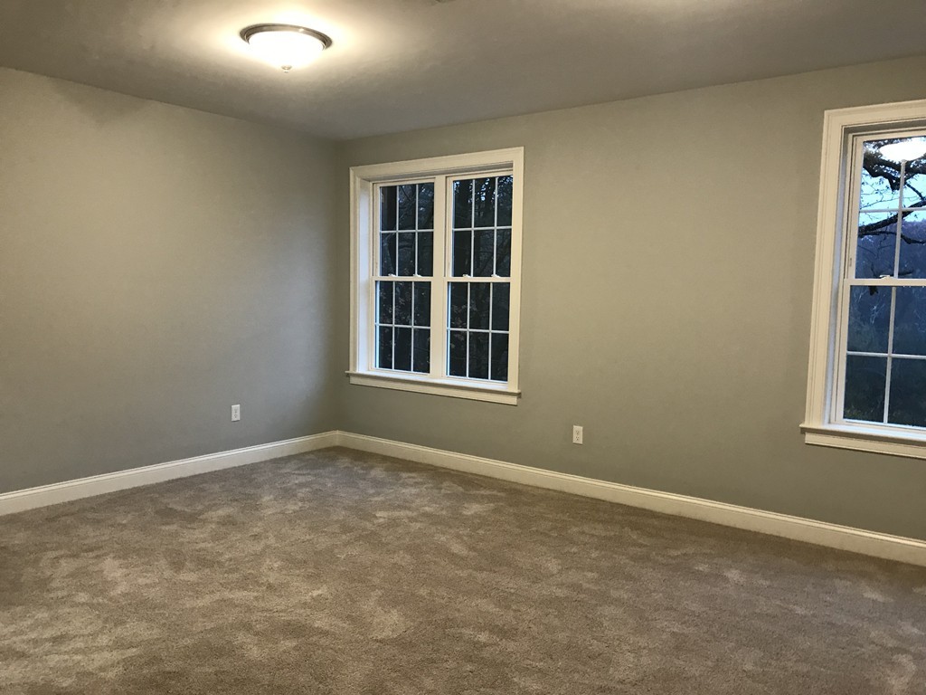 57 Wellesley Rd Extension Natick, MA 01760 - Photo 20 of 26 an empty room with windows
