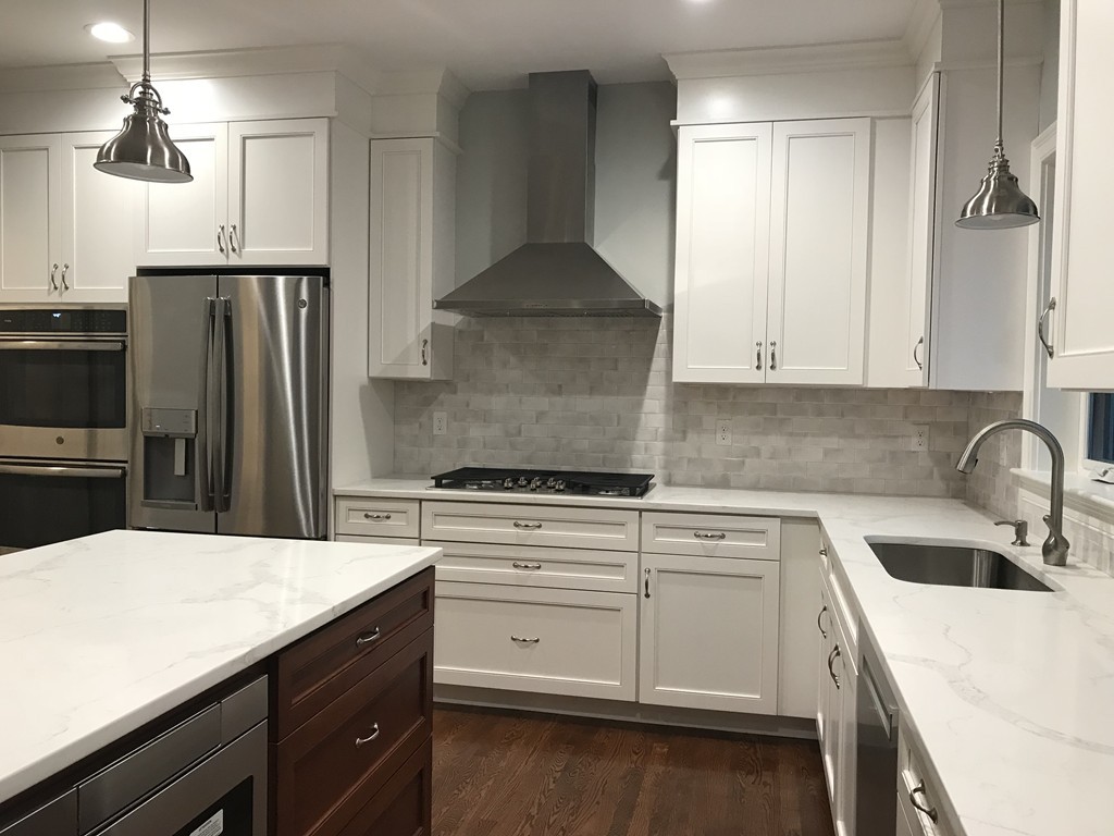 57 Wellesley Rd Extension Natick, MA 01760 - Photo 3 of 26 a kitchen with a sink a stove and refrigerator