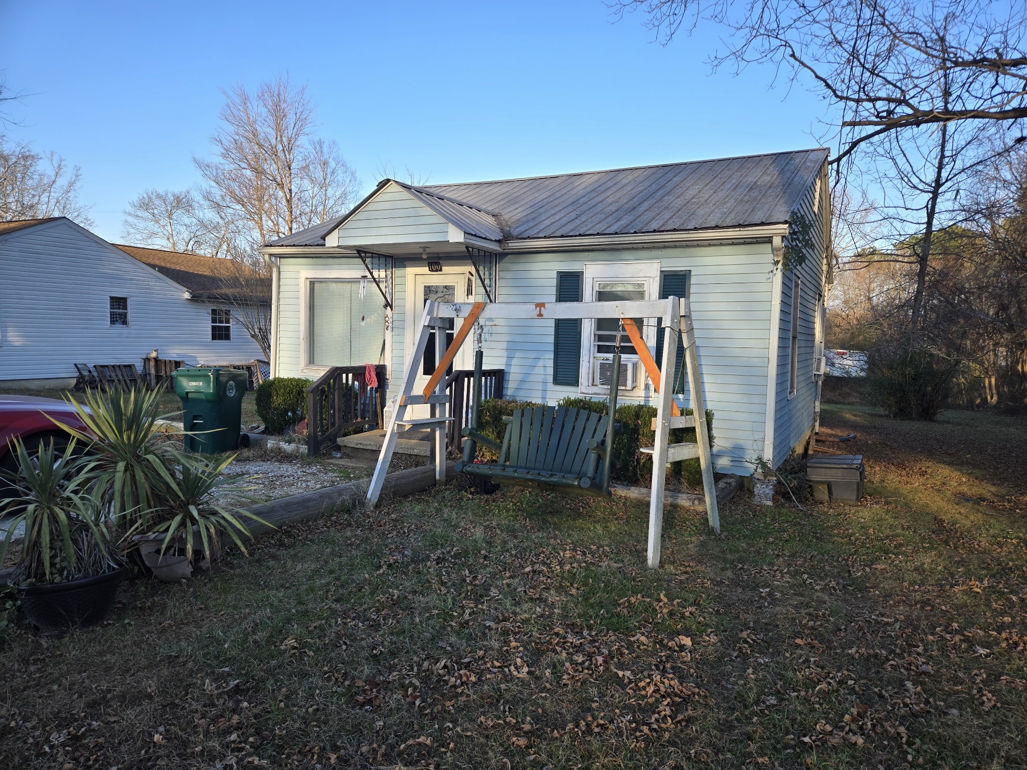 100 Indian Creek Road McEwen, TN 37101 - Photo 2 of 14 a view of a wooden house with a yard table and chairs