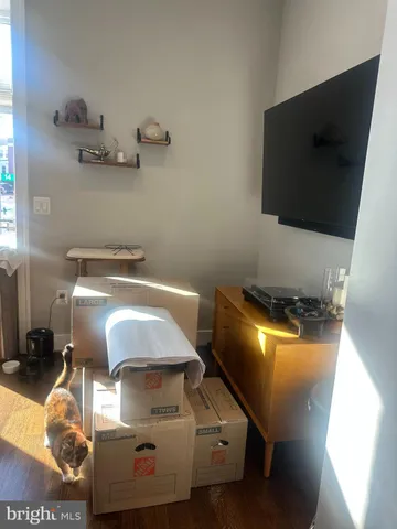 a room with gym equipment and a flat screen tv