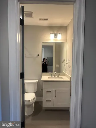 a kitchen with granite countertop a stove and a sink