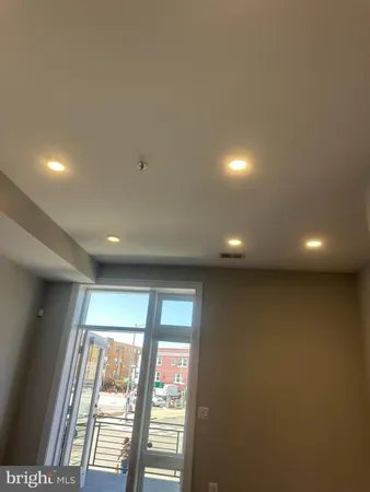 a bathroom with a shower and a sink