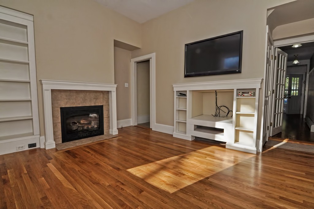87-89 Pleasant Street Needham, MA 02492 - Photo 12 of 30 a bedroom with a bed and a flat screen tv