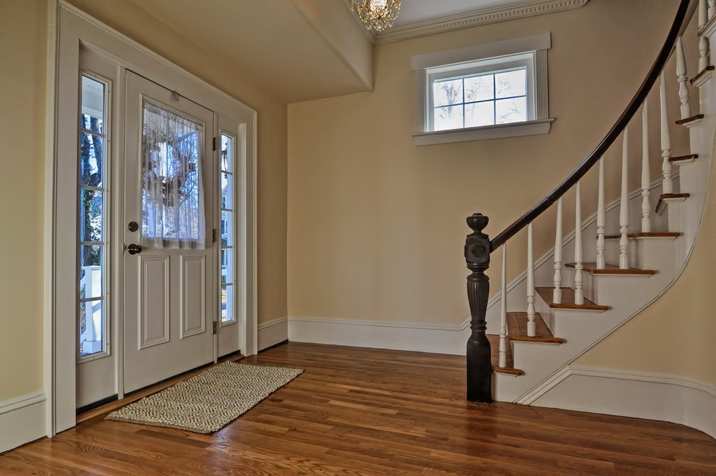 87-89 Pleasant Street Needham, MA 02492 - Photo 2 of 30 a view of an entryway with wooden floor and door