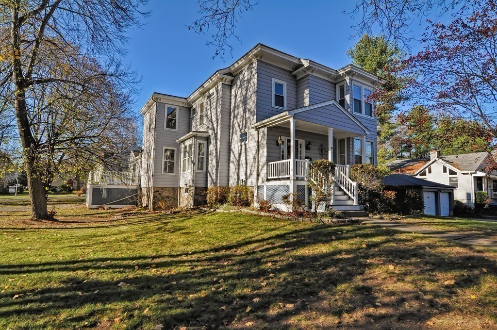 87-89 Pleasant Street Needham, MA 02492 - Photo 21 of 30 a front view of a building with a garden