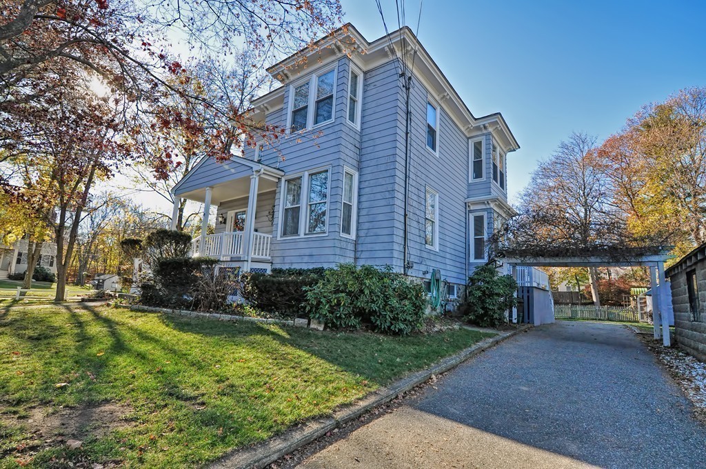 87-89 Pleasant Street Needham, MA 02492 - Photo 22 of 30 a front view of a house with a yard