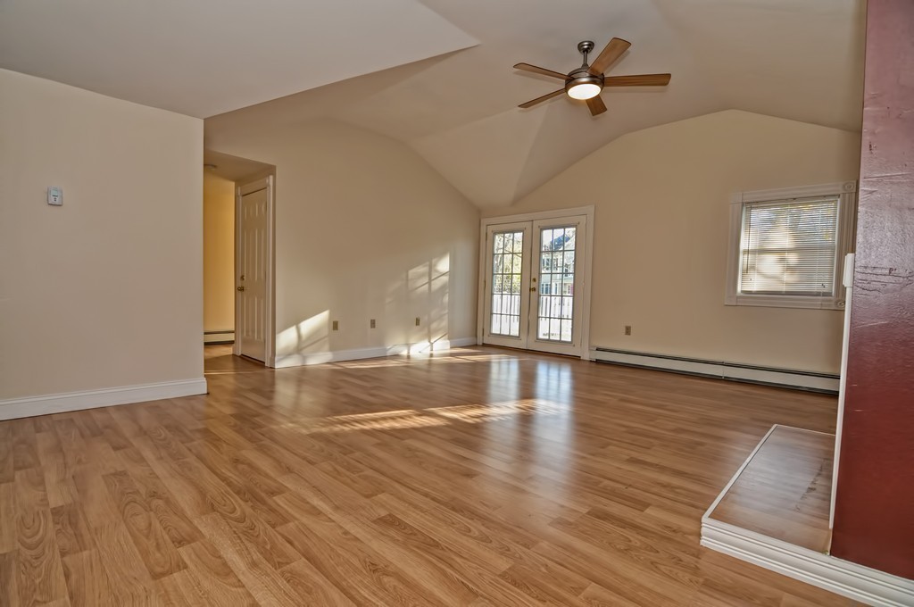 87-89 Pleasant Street Needham, MA 02492 - Photo 25 of 30 a view of empty room with wooden floor and fan